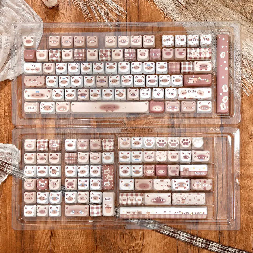 Full layout of the Boba Siamese cat ear keycaps in a clear storage tray, featuring milk tea colors and gingham patterns.