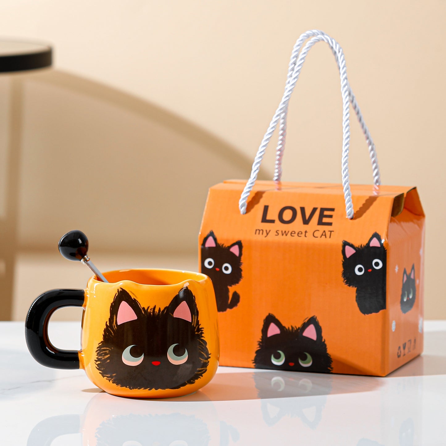 Love My Sweet Cat Coffee Mug, Orange Mug with Cute Fluffy Black Cat Print, Handmade Coffee Mug with Cute Cat Tail Styled Spoon, behind is the cute package