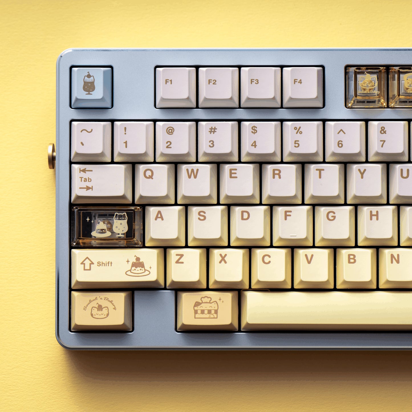 Baking Meow Meow cat keycap set in yellow, brown, and blue with 167 keys