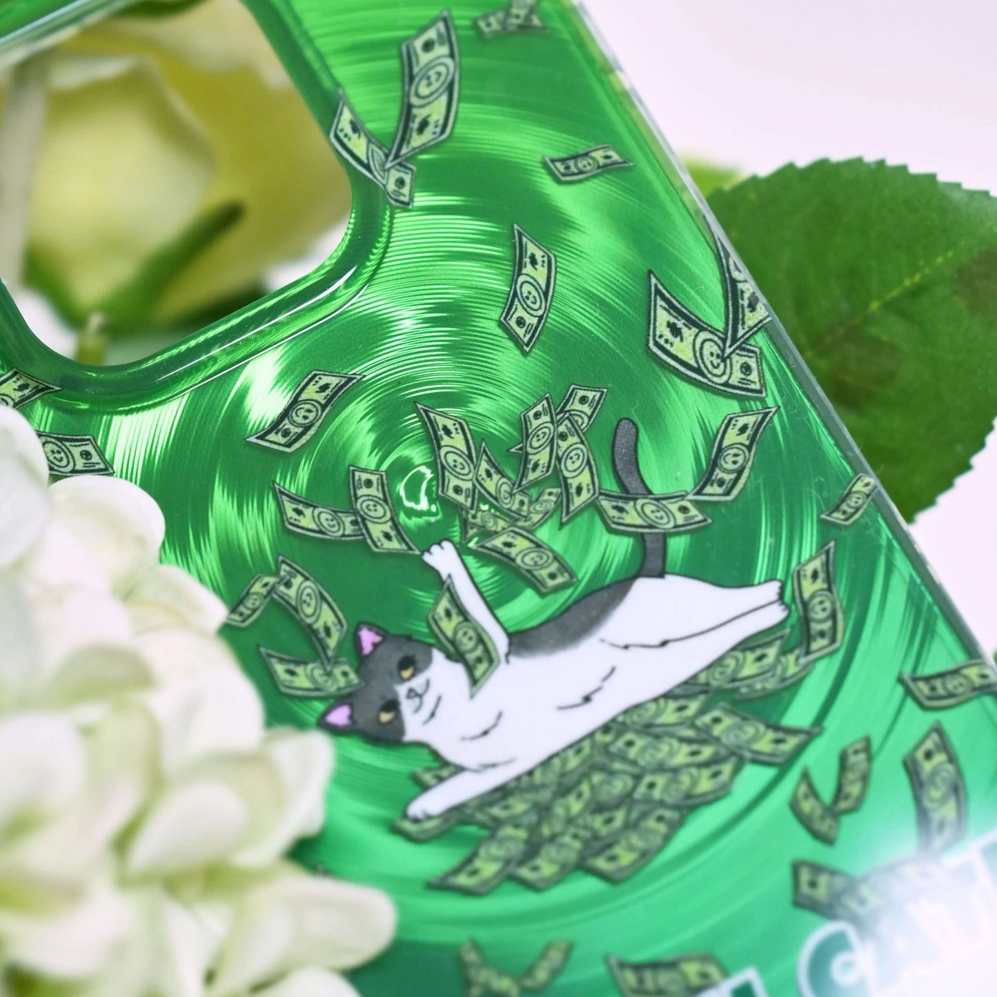 Close-up of the Cash Cat green phone case showing fine details of the money vortex