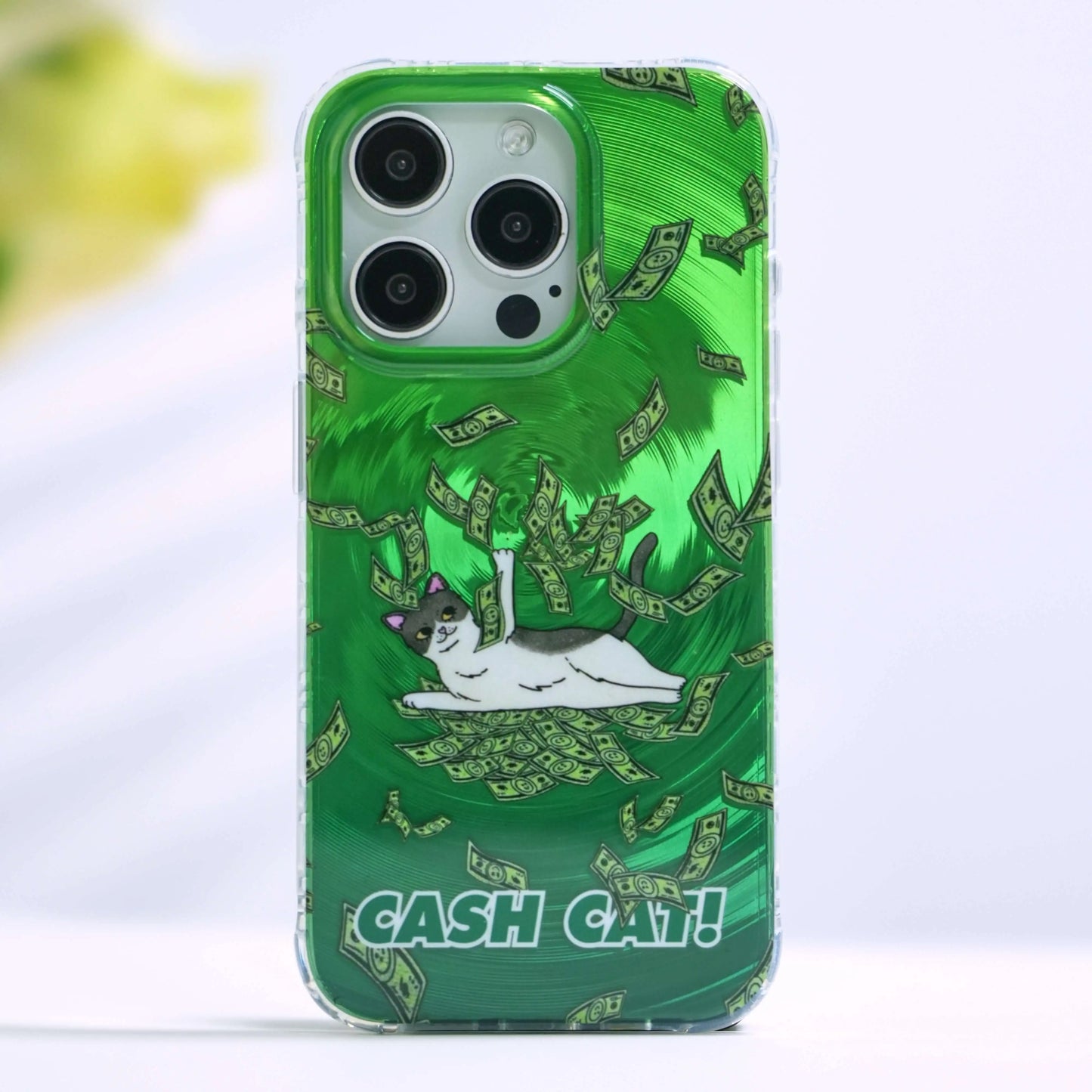 Cash Cat green phone case featuring a tuxedo cat lying in a whirlwind of money