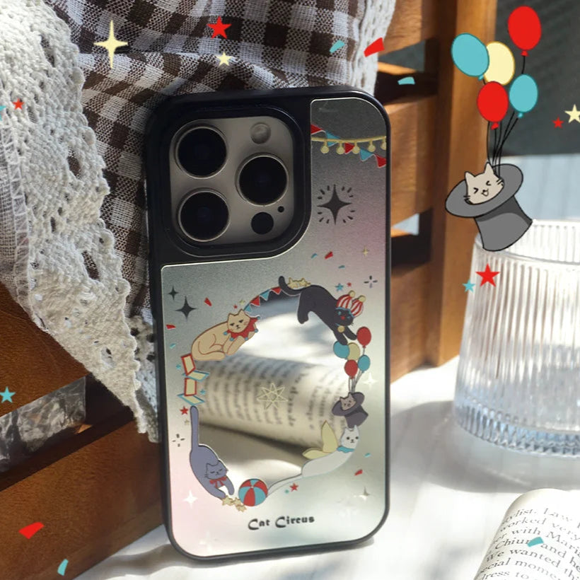 Close-up of the Cat Circus mirror phone case highlighting the fine details of playful circus cats