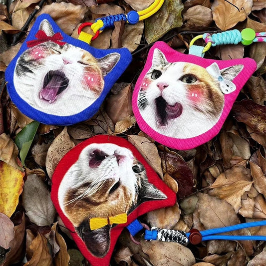 Personalized cat-shaped purse holding coins and keys, perfect for cat lovers