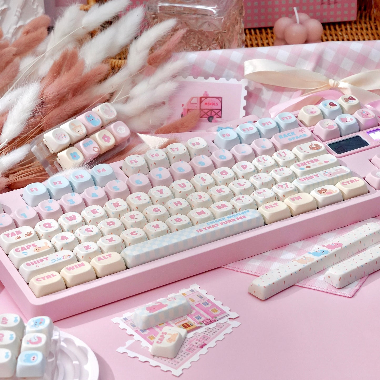pink and cream keycaps with cute cat icons and cherry profile