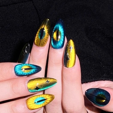 Close-up of Feline Glow Show Press-On Nails with glowing cat-eye pattern.