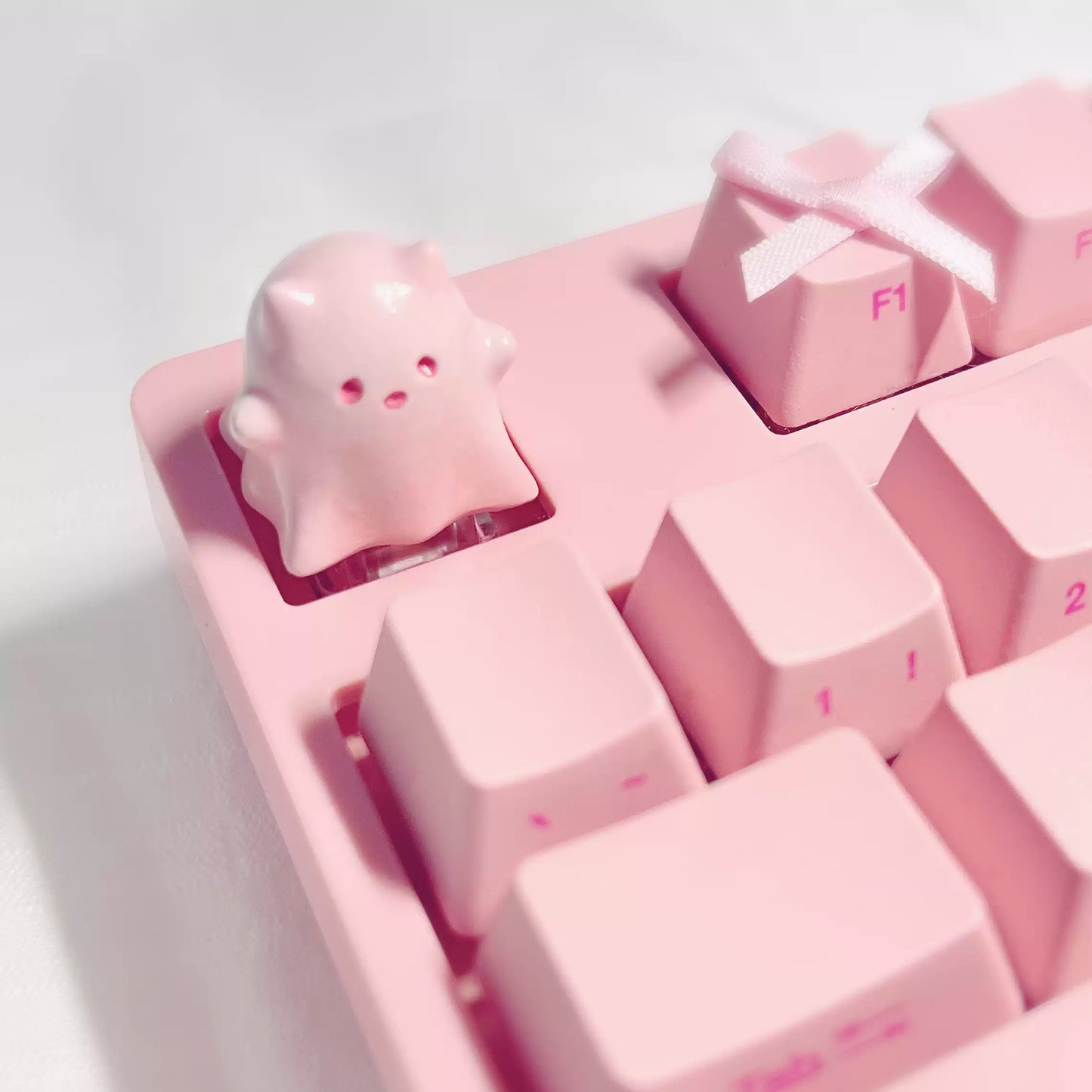 Ghostly Whiskers mechanical keyboard keycap with ghost kitten design, perfect Halloween gift for gamer girls and cat lovers.