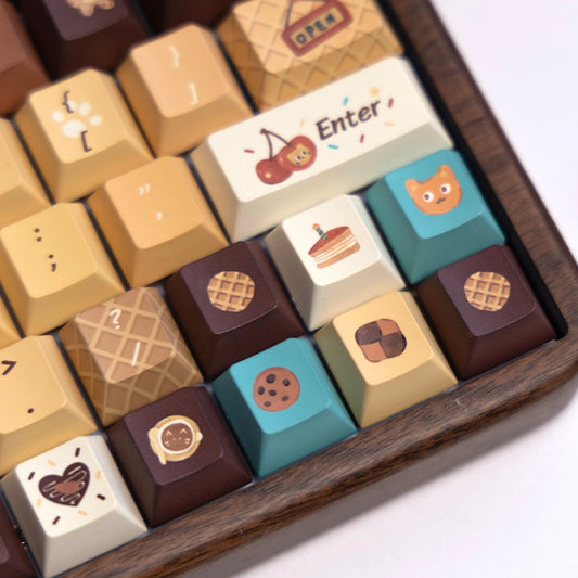 Adorable ginger cat and brown bakery-themed keycap set, perfect for gamer girls and cat lovers.