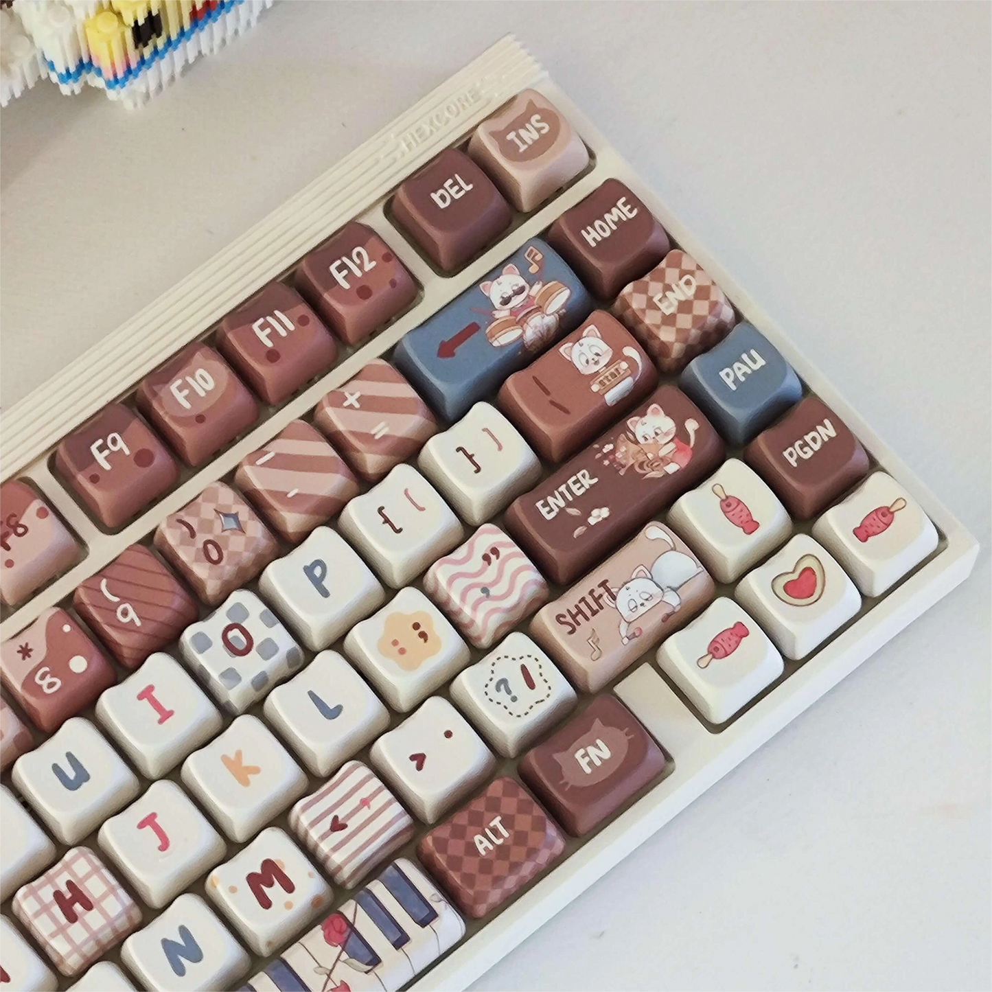 Kitty Concert Keycap Set installed on a keyboard with a brown and white theme, featuring cat and music designs.