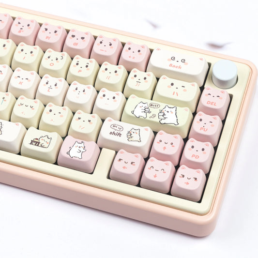 Cute white cat-themed keycap set in pastel pink and yellow colors, perfect for gamers and cat lovers.