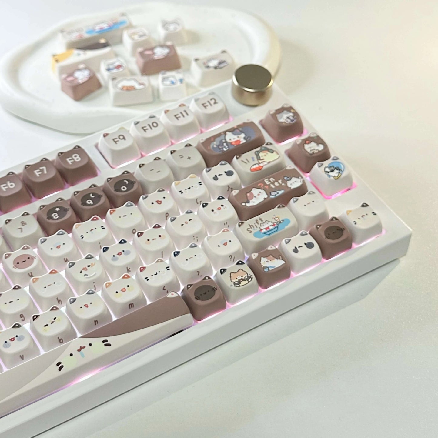 Close-up of the Mocha Cat Keycap Set with various cat designs