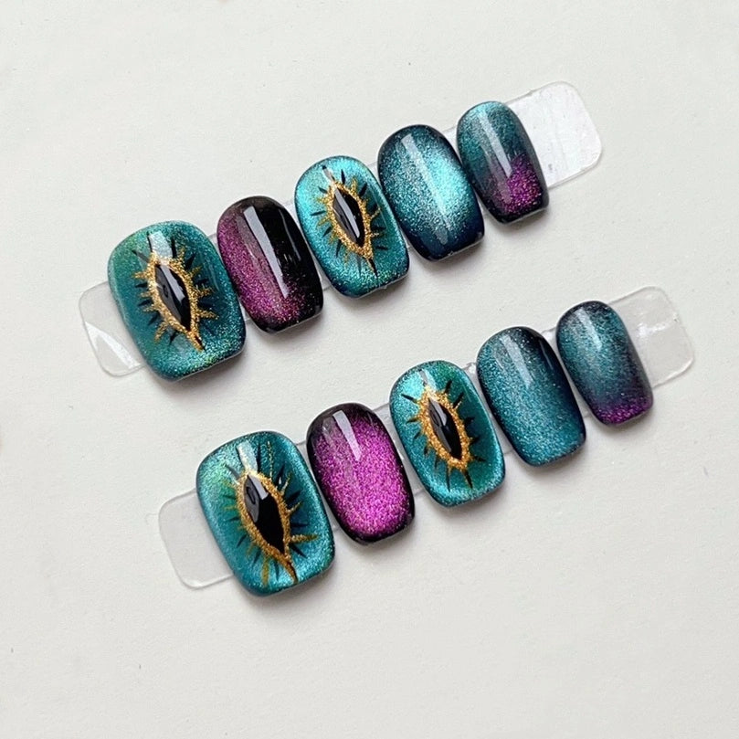 Mystic Kitty Gaze Handmade Press-On Nails featuring a mesmerizing cat-eye design with a mystical shimmer.