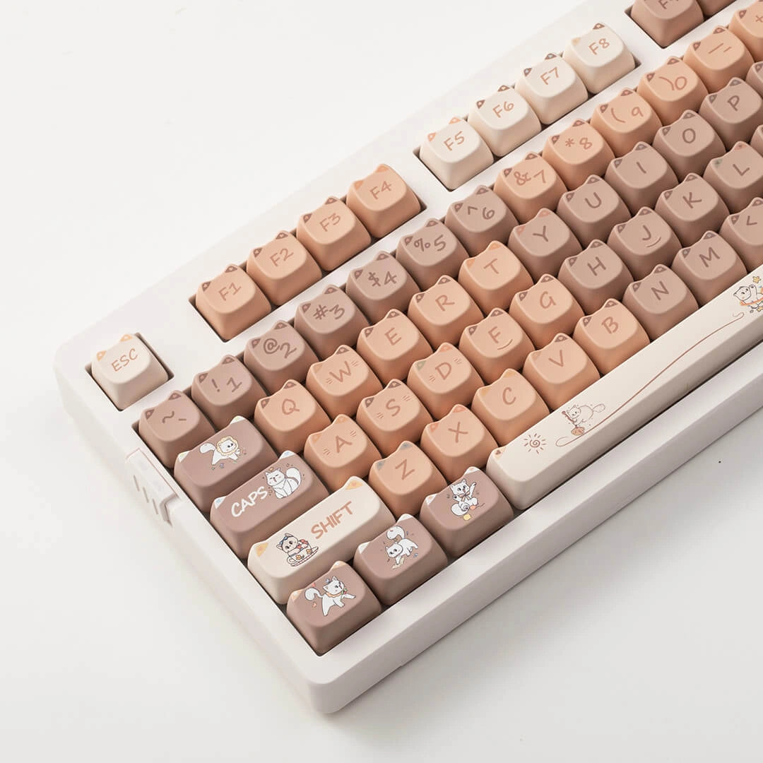 Naughty Cat Keycap Set in brown and beige with adorable cat-shaped keycaps featuring playful designs.