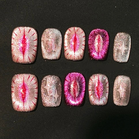 Pink glitter cat-eye press-on nails from Cat Lady's Find, perfect Halloween gift for feline enthusiasts.