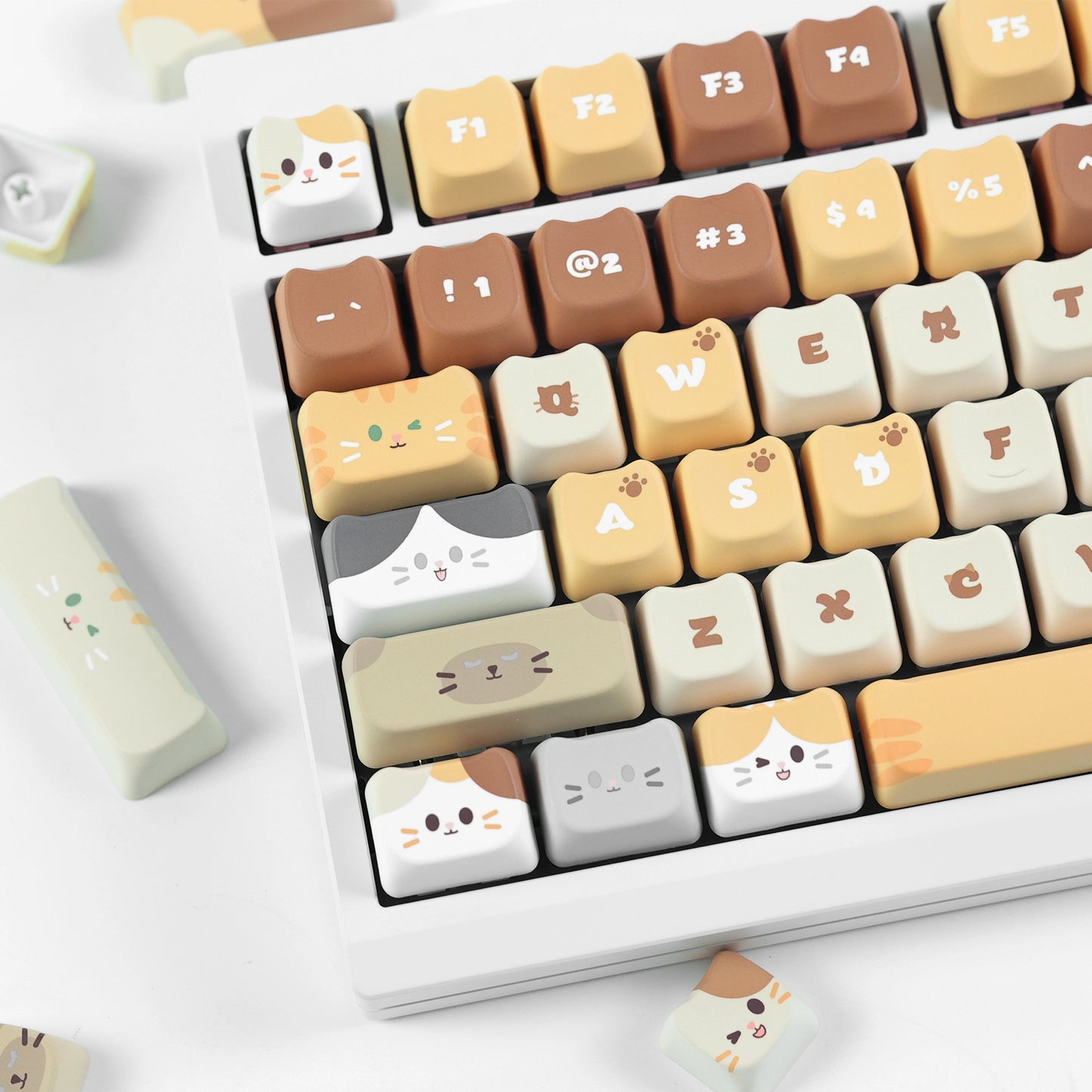 Purr-fectly Stacked Keycap Set featuring brown and white cat faces for mechanical keyboards.