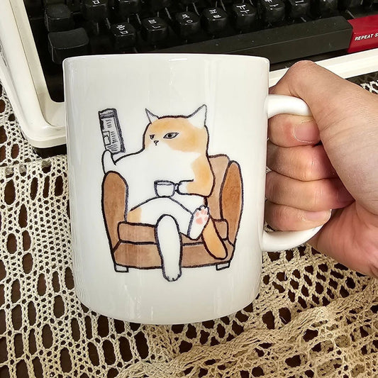 City Cat's Life Coffee Mug, handmade bone china coffee mug, cat print coffee mug, ginger cat sitting on the sofa reading the newspaper