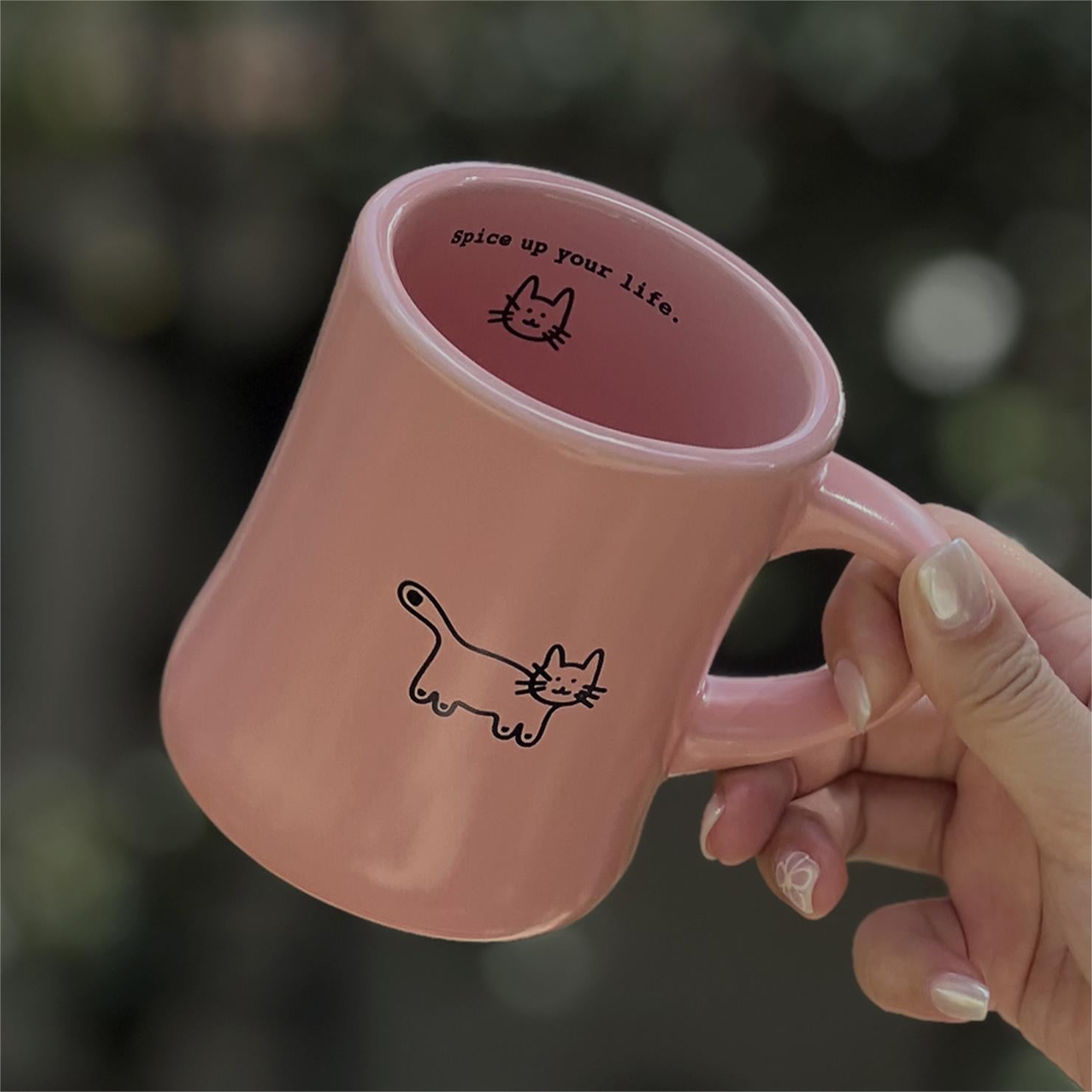 Woman holding the Aimer Pink Love Yourself Coffee Mug, cute cat illustration. Pawsome Gift for Cat Lovers and Cat Owners.