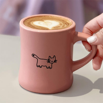 Woman Holding the Aimer Pink Love Yourself Coffee Mug, cute cat illustration, with latte in it. Pawsome Gift for Cat Lovers and Cat Owners.