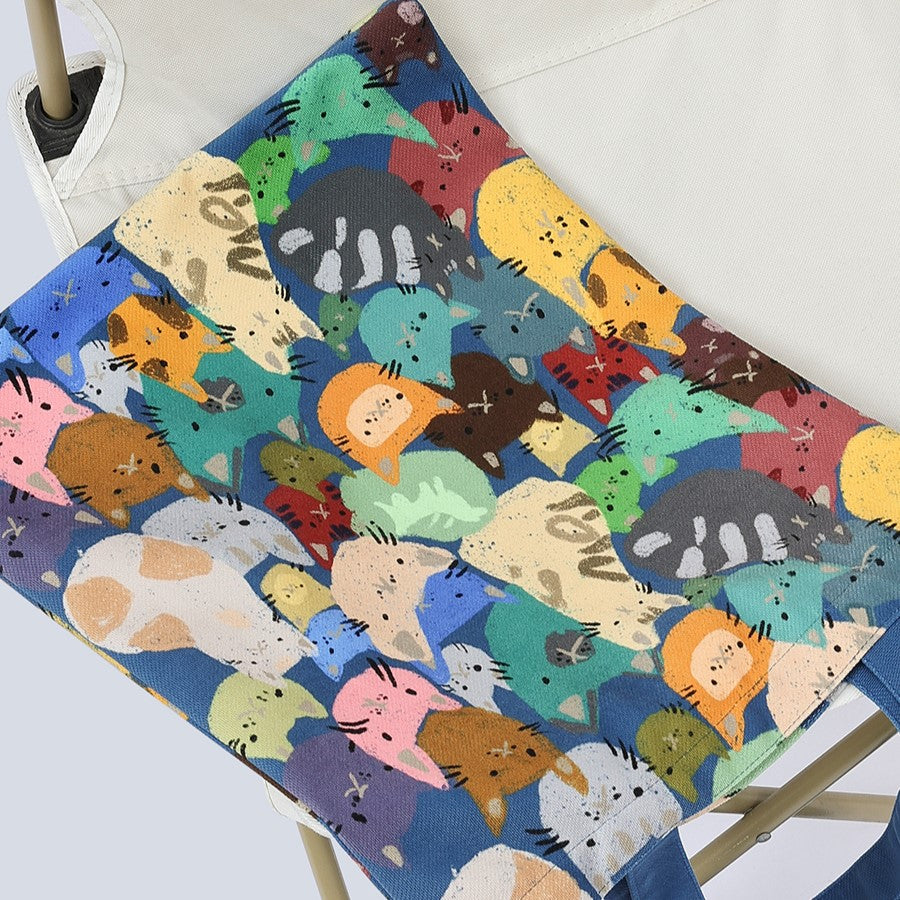 Cat Paradise Canvas Shoulder Tote, playful dark blue design filled with cute cats. Eco-friendly Canvas Shopping Tote, bag on the chair