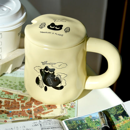 Black Cat's Travel Coffee Mug, cream color with lid, cute black cat illustration with trees and airplane. purrfect gift choice for cat lovers