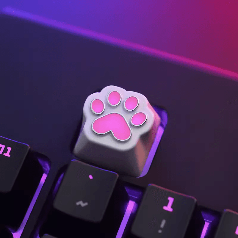 Aluminum Cat Paw Mechanical Keyboard Keycap on a Black Keyboard with Lights on