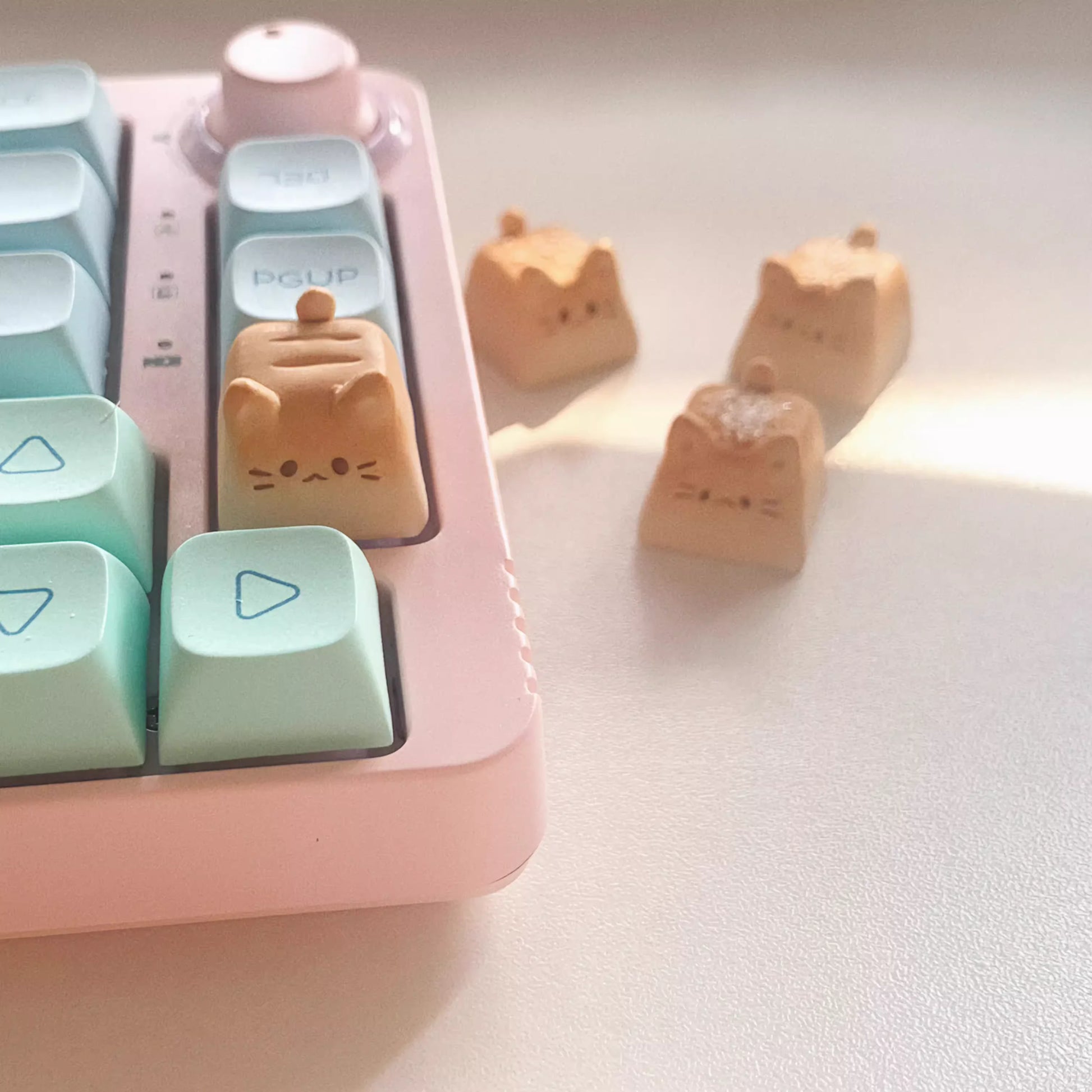 Handmade Bread Cat Mechanical Keyboard Keycap, White Bread on a Mechanical Keyboard and Sesame Bread, Vanilla Bread, and Chocolate Bread in the Background