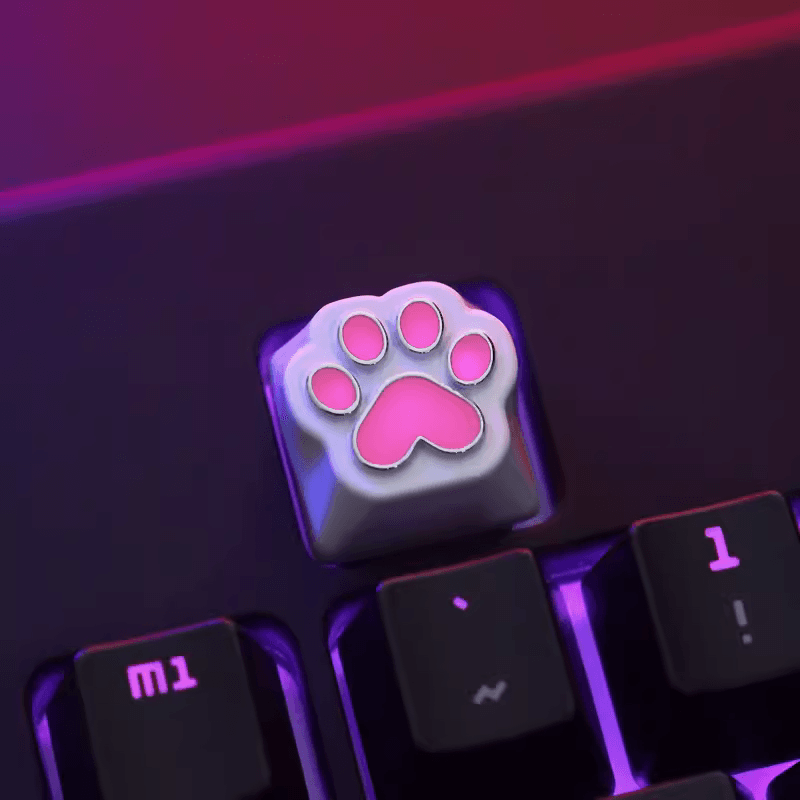 Aluminum Cat Paw Mechanical Keyboard Keycap on a Black Keyboard with Lights on