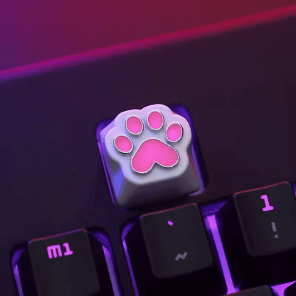 Aluminum Cat Paw Mechanical Keyboard Keycap on a Black Keyboard with Lights on