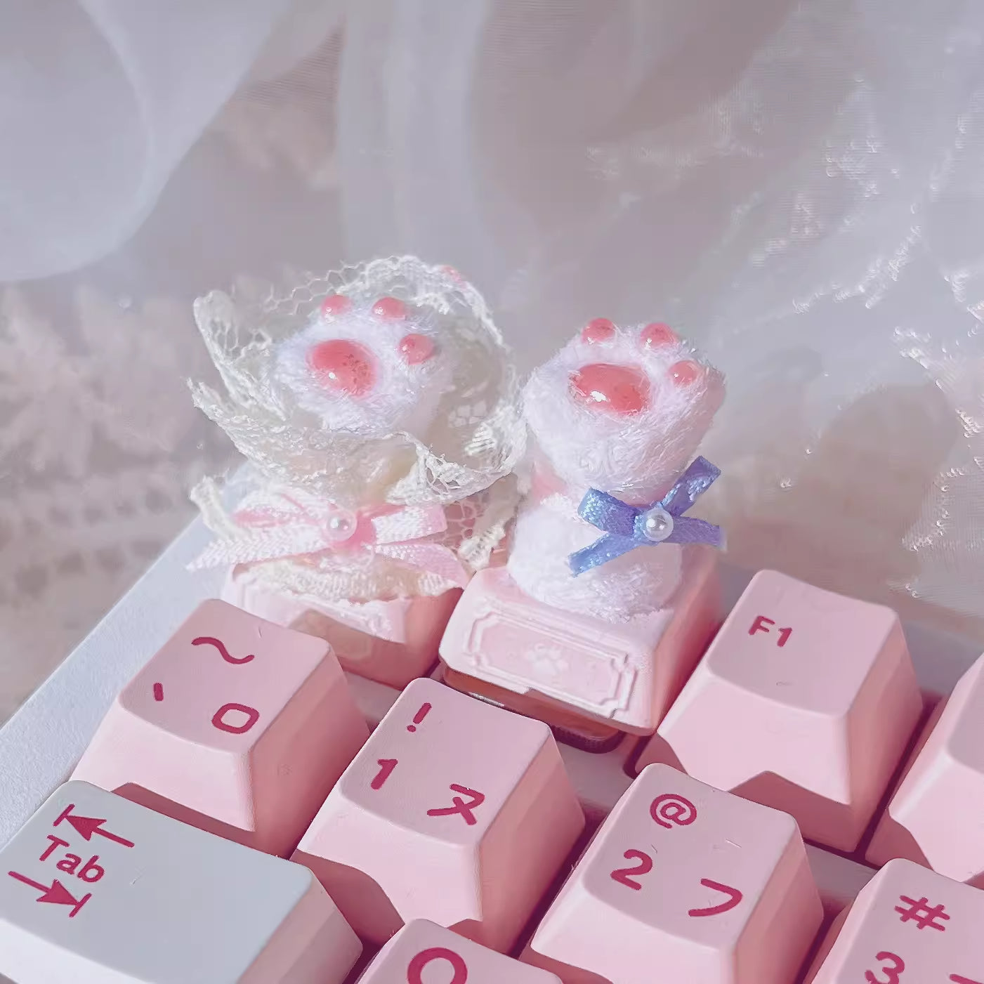 Handmade Wedding Cat Paw Mechanical Keyboard Keycap in Bouquet and Bowknot on a keyboard with other pink key caps in Japanese