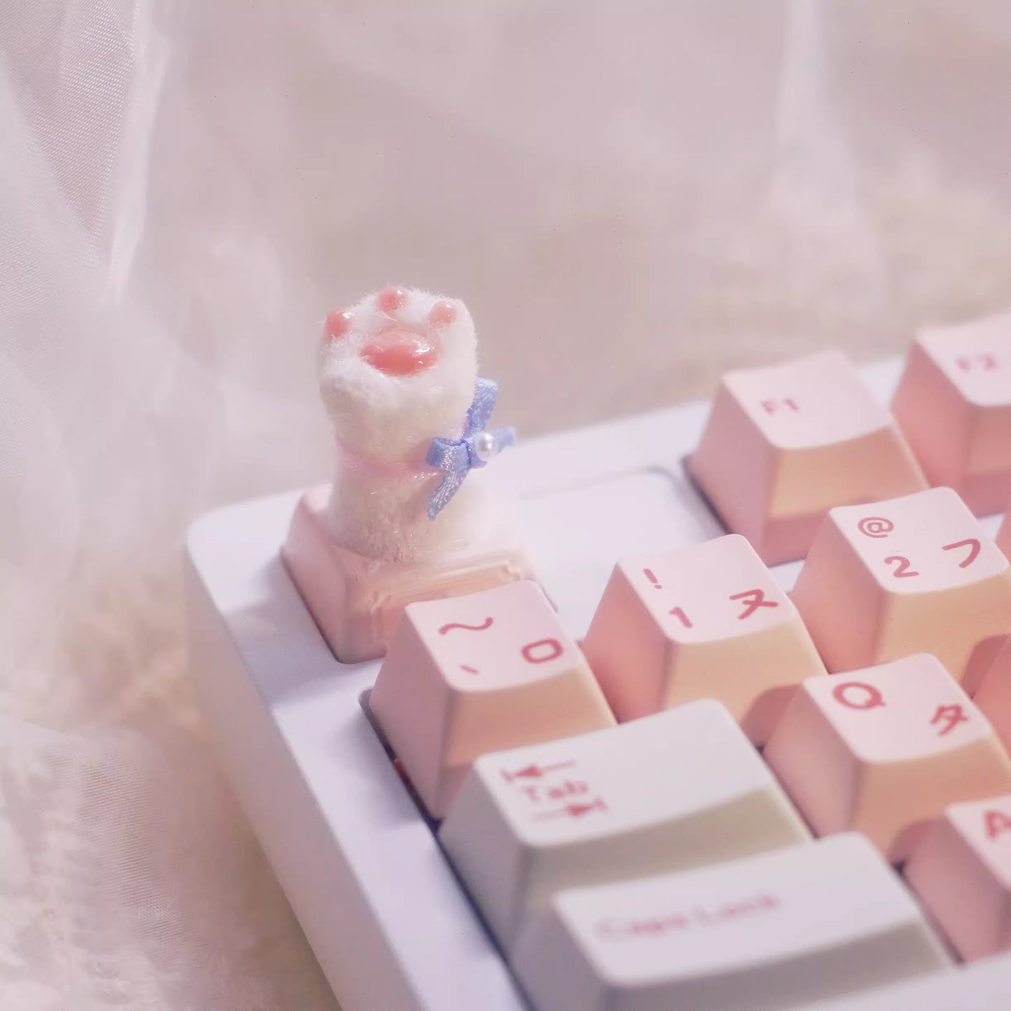 Handmade Wedding Cat Paw Mechanical Keyboard Keycap in Bowknot on a keyboard with other pink key caps in Japanese