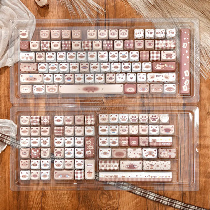 Full layout of the Boba Siamese cat ear keycaps in a clear storage tray, featuring milk tea colors and gingham patterns.