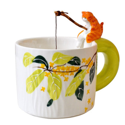 Cat Go Fishing Handmade Coffee Mug, white mug with flower print, Ginger Cat sitting on the mug with fishing rod in it's hand