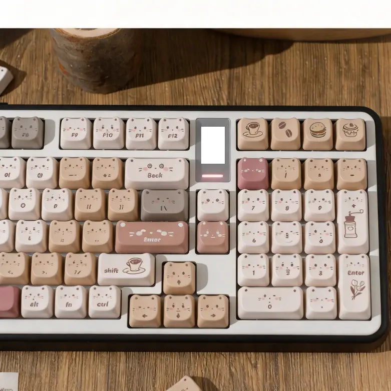 Hand-drawn coffee kitty cat ear keycaps in mocha and beige on a mechanical keyboard.