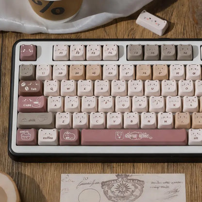 Cozy cafe themed MAO profile keycaps with coffee bean and cat face motifs.