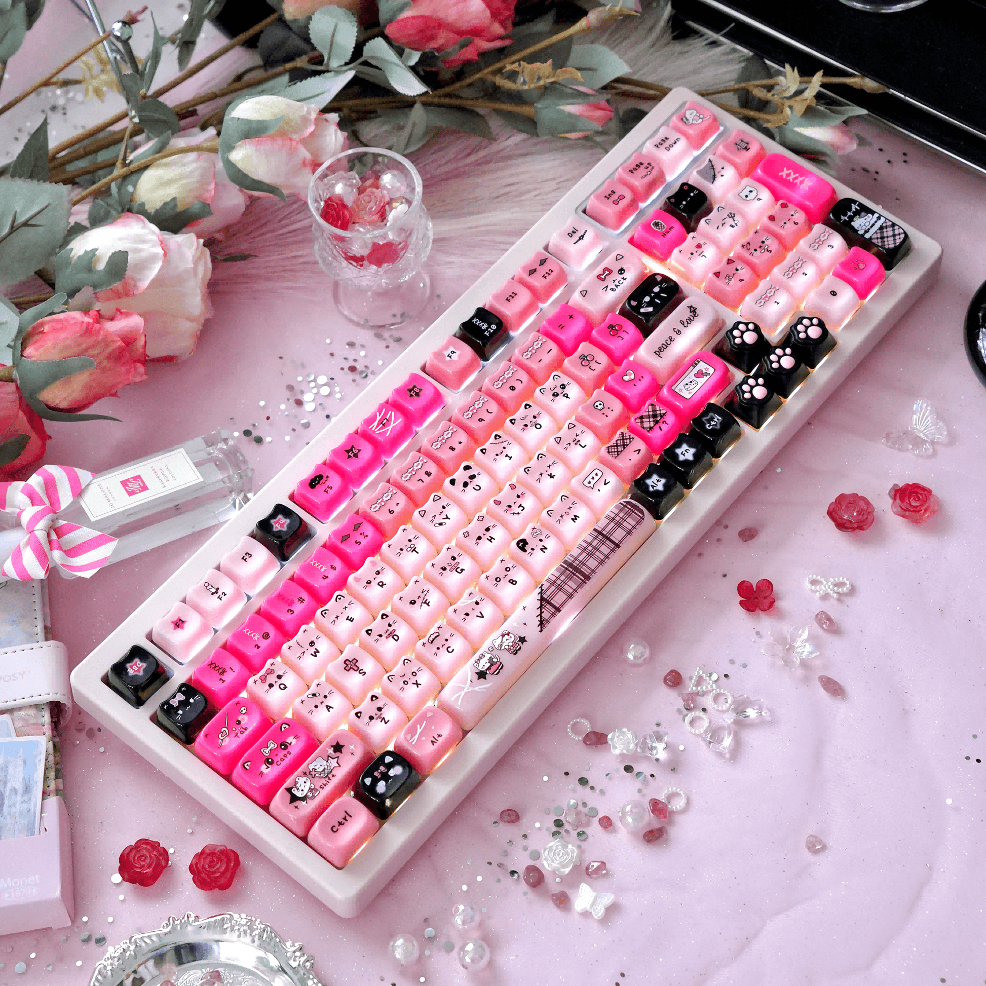 Kawaii pink and black Y2K style pudding cat ear keycap set layout.
