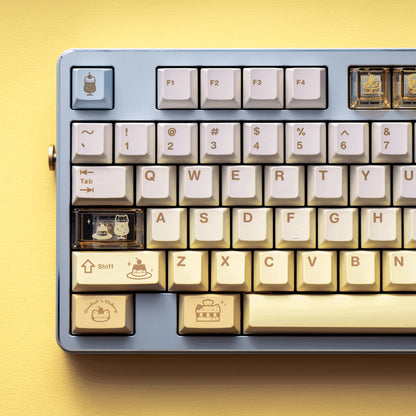 Baking Meow Meow cat keycap set in yellow, brown, and blue with 167 keys

