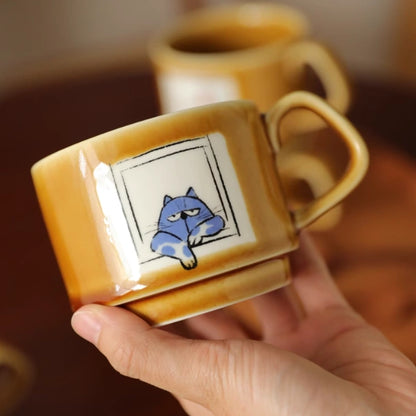 Ceramic mug with a cute and mischievous design featuring British Shorthair cats.