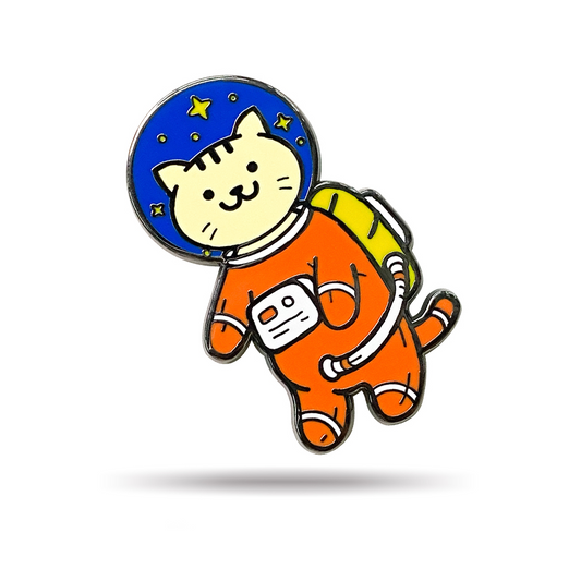 Reach for the stars with this purrfectly adorable Cat Astronaut Pin! Featuring a cute ginger cat in a vibrant orange spacesuit with starry surprises in the helmet, this pin is a pawsome gift for cat lovers and ginger cat owners alike. Add it to your backpack, clothes, or camera strap for a playful touch of feline fun!