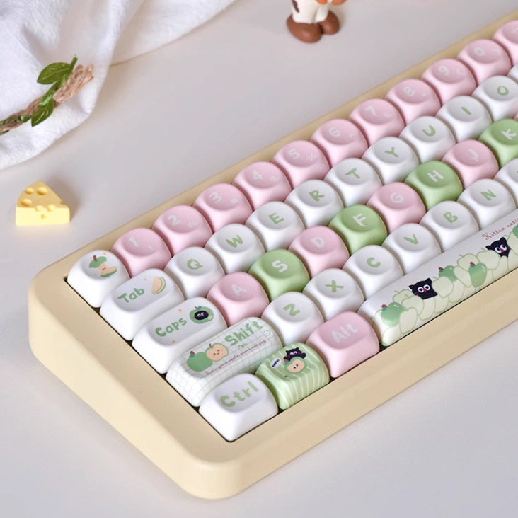 Pastel black cat and apple keycaps for mechanical keyboard enthusiasts
