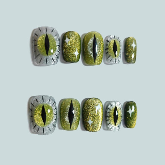 Emerald Enchantress handmade press on nails with spooky green cat-eye design from Cat Lady's Find