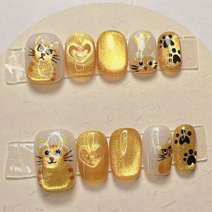 Cute ginger cat press-on nails with paws and hearts design for cat lovers
