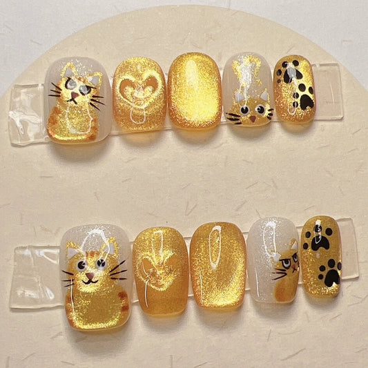 Cute ginger cat press-on nails with paws and hearts design for cat lovers
