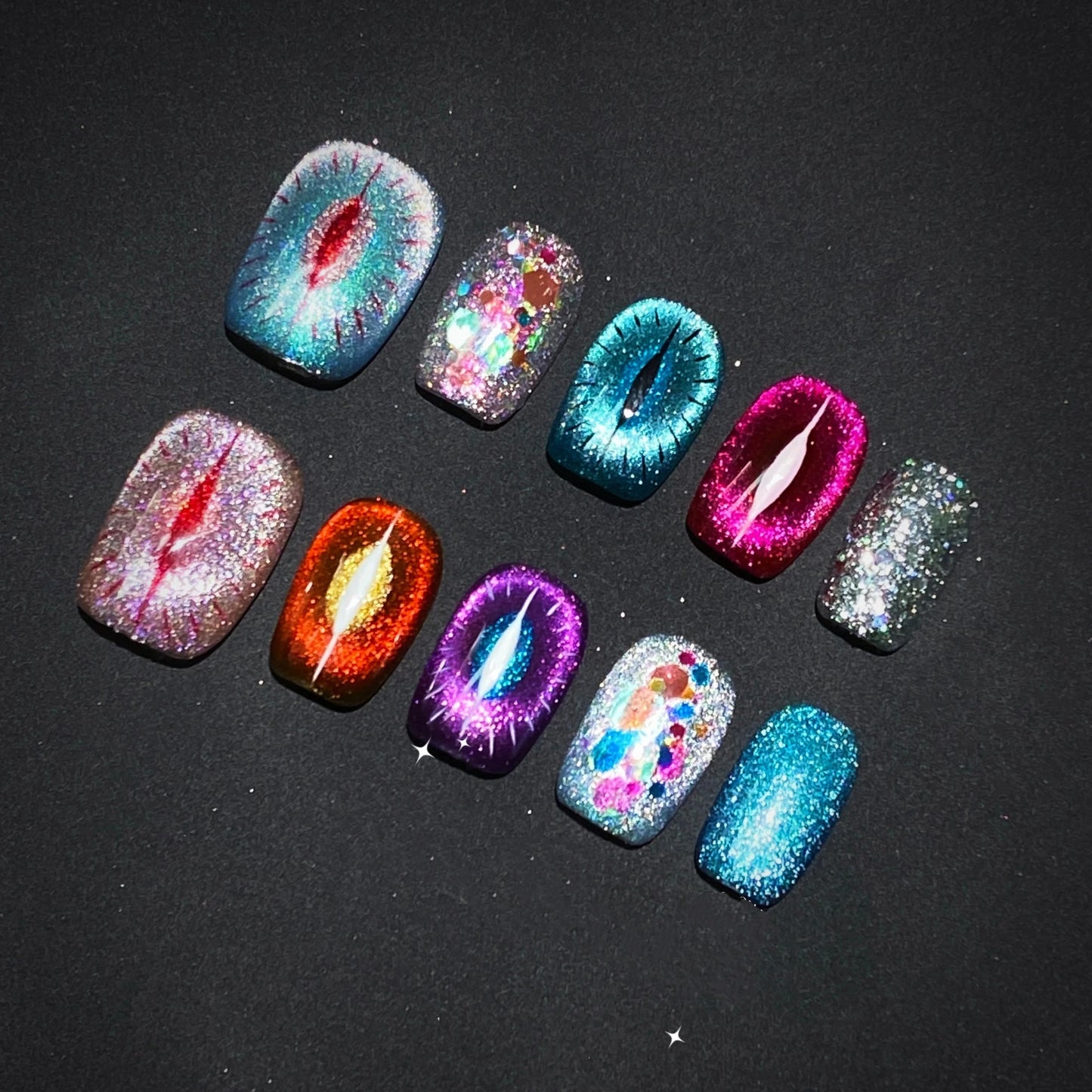 Front view of Goddess Purr-glow handmade cat-eye press on nails in vibrant colors.