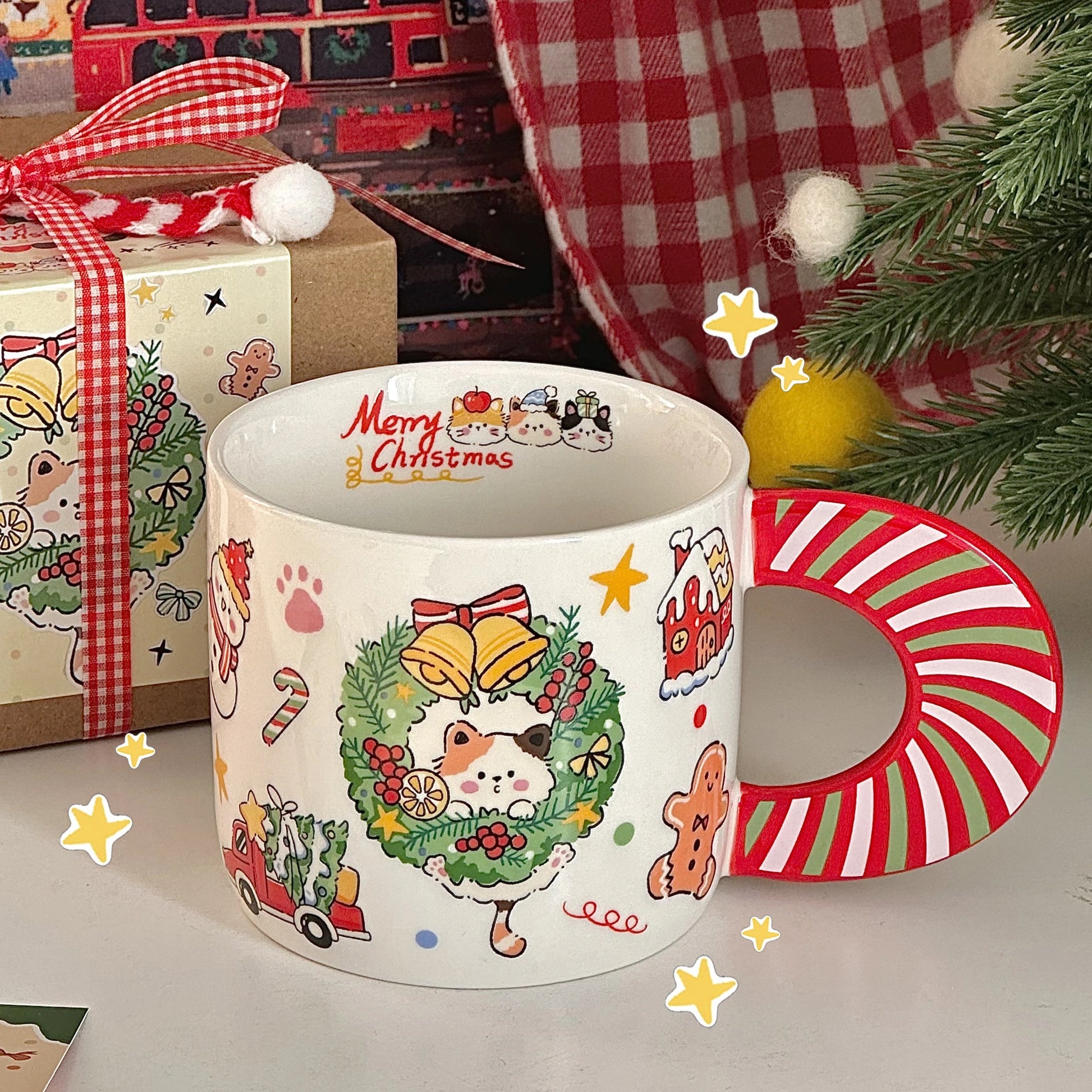 Jolly Kitty Christmas Mug featuring a playful calico cat surrounded by festive holiday designs and candy cane handle.