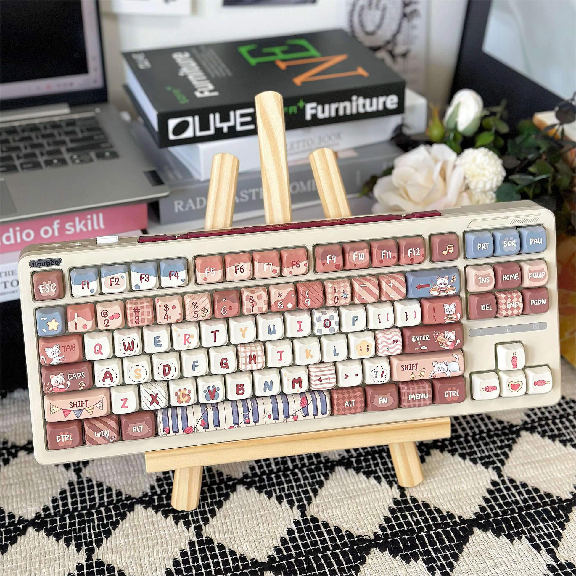 Stylized desk setup with the Kitty Concert Keycap Set installed on a keyboard, featuring a brown color scheme with cute cat and music themes.