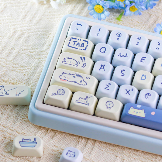 Lazy Cat Keycap Set featuring cute white cat and blue design for mechanical keyboards.