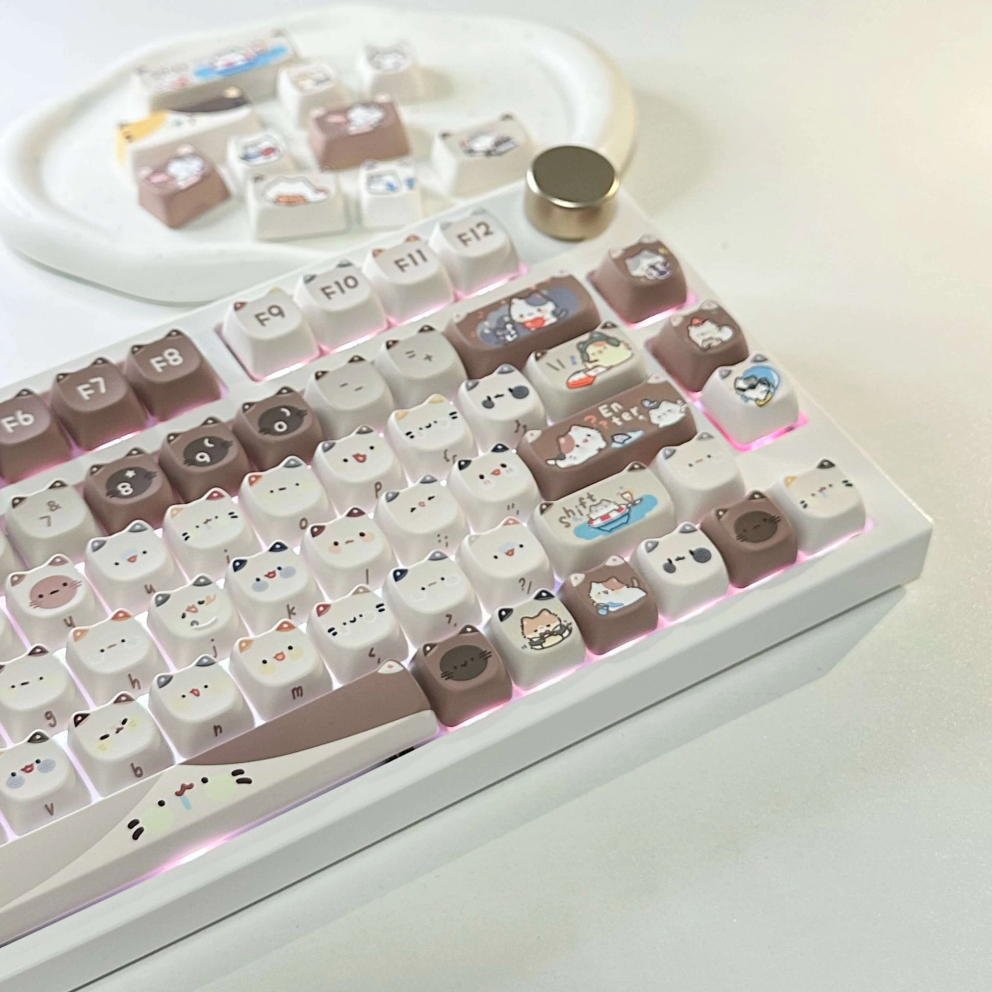 Close-up of the Mocha Cat Keycap Set with various cat designs