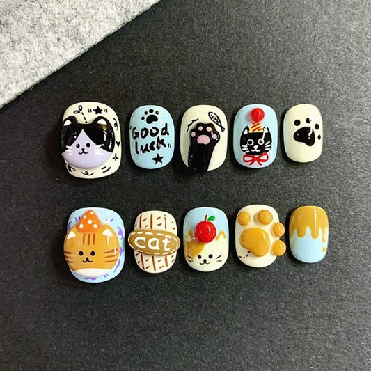 Paw-sitive Vibes Only press-on nails with cute ginger and tuxedo cat designs
