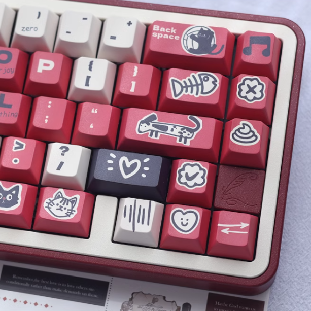 Angled view of the Paws and Claws Showdown Keycap Set, highlighting the detailed illustrations and color combination of red, beige, and black.