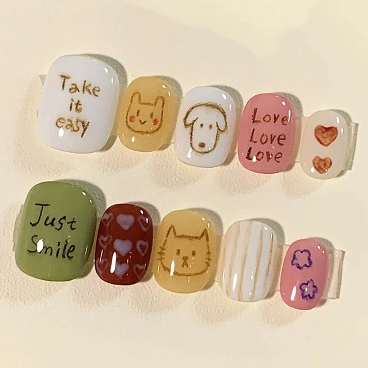 Cute handmade press-on nails with cat and dog art, perfect for pet lovers