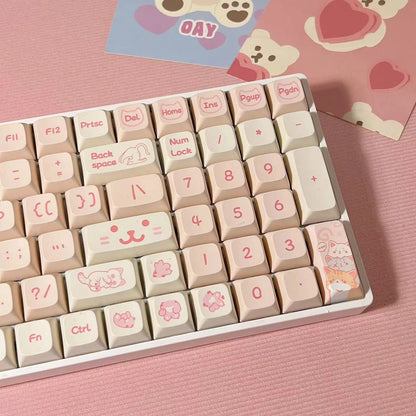 Pink mechanical keyboard keycaps with charming cat designs, ideal gift for gamers and cat enthusiasts.